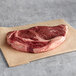 A Warrington Farm Meats Delmonico steak on a piece of paper