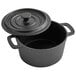 A black cast iron pot with a lid.