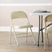 Lancaster Table & Seating Beige Vinyl Folding Chair with Padded Seat Main Thumbnail 1