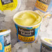 A close up of a container of Minute Maid frozen lemonade with a blue and yellow label.