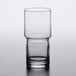 A close-up of a clear Libbey stackable beverage glass.