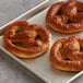 A J & J Snack Foods SuperPretzel Bavarian soft pretzel on a tray.