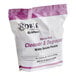 A white bag of Noble Chemical heavy-duty cleaner and degreaser QuikPacks with purple text.