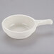 A white Tuxton French casserole bowl with a handle.