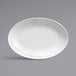 A white oval Libbey porcelain platter with a decorative rim.