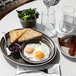 A Libbey Englewood porcelain plate with eggs, bacon, and toast on it.