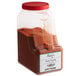 A plastic container of red Regal Pennsylvania Pork Twang spice blend.