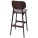 A BFM Seating Emma dark walnut wooden bar stool with a black seat and backrest.