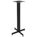 A BFM Seating black stamped steel bar height cross table base for a square table.