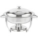 A silver metal Vollrath Orion chafer with a lid on a table.
