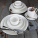 A group of Libbey Royal Rideau white porcelain coupe plates.