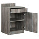 A grey wooden BFM Seating waitress station cabinet with open doors.
