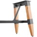 A Lancaster Table & Seating wooden and metal trestle table leg.