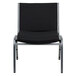 A Flash Furniture Hercules black fabric stack chair with a silver frame.