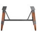 A Lancaster Table & Seating wooden trestle table base with a metal frame and two legs.
