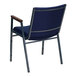 A navy blue Flash Furniture stack chair with metal armrests.