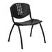 A black plastic Flash Furniture stack chair with a cutout back.