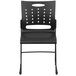 A black Flash Furniture stack chair with a metal sled base and air-vent back.