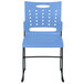 A blue plastic Flash Furniture stack chair with black legs and air-vent back.