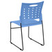 A blue Flash Furniture stack chair with black legs.