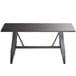 A black rectangular Lancaster Table & Seating dining table with metal legs.