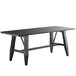 A long black Lancaster Table & Seating live edge dining table with legs.