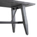 A Lancaster Table & Seating wooden dining table with metal legs and an antique slate gray finish.