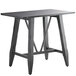 A Lancaster Table & Seating solid wood live edge bar height trestle table with legs and an antique slate gray finish.