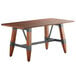 A Lancaster Table & Seating wooden dining table with metal legs.