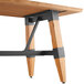 A Lancaster Table & Seating solid wood live edge dining table with metal legs.