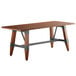 A Lancaster Table & Seating wooden table with metal legs.