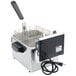 A Waring commercial countertop electric deep fryer with a wire basket.