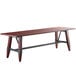 A Lancaster Table & Seating solid wood dining table with metal legs and an antique mahogany finish.