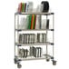 A MetroMax 4 metal rack with trays and dishes on it.