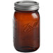 A Ball Quart Elite amber glass jar with a silver metal lid.