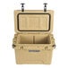 A beige CaterGator outdoor cooler with the lid open.