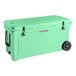 A seafoam green CaterGator outdoor cooler with wheels and black handles.