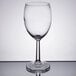 A close-up of a Libbey Napa Country wine glass on a reflective surface.