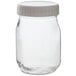 A clear glass jar with a white lid.