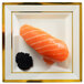 A Fineline ivory plastic square plate with a piece of salmon and caviar.