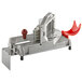 A silver and red Prince Castle tomato slicer.