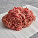 A pile of Warrington Farm Meats ground chuck, short rib, and brisket hamburger blend on a white napkin.