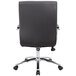 The back of a Boss B696C-BK black office chair with chrome base and wheels.