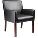 A Boss black leather arm chair with mahogany finish.