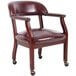 A Boss burgundy vinyl Captain's chair with casters.