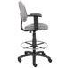 A Boss gray drafting stool with adjustable arms and a black base.
