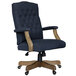 A navy blue Boss office chair with wooden legs.