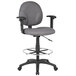 A gray Boss drafting stool with adjustable arms and metal base with footring.