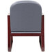A Boss gray fabric side chair with a wooden frame.