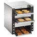 A Vollrath dual conveyor toaster with bread on it.